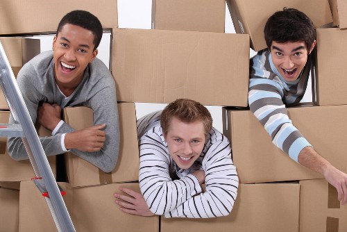 Removal team planning a Chelsea home move near a townhouse street