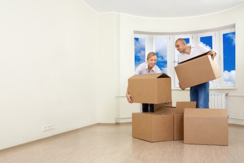 Loading furniture into a moving truck in Chelsea street setting
