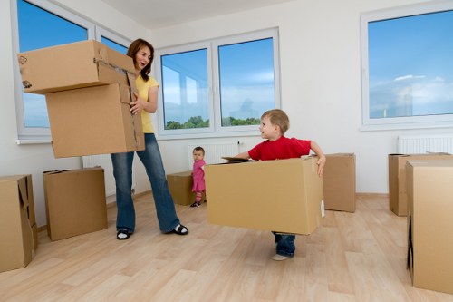 Professional movers loading household items for a Chelsea relocation