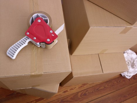 Checklist and packed boxes prepared for a Chelsea flat relocation