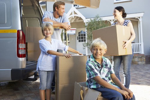 Local removal truck loaded with household furniture and boxes in Chelsea