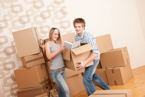 Unloading boxes into a Chelsea property during moving day