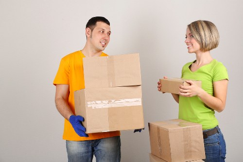 Local moving team loading furniture into a van in Chelsea