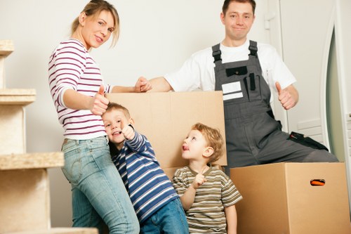 Professional removal staff loading furniture in Chelsea